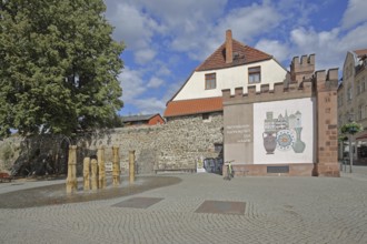Historic Hague Gate and part of the former town wall, fountain, Haldensleben, Saxony-Anhalt,