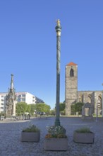 Column with golden butter maiden, Roland and church ruins of St. Nikolai, landmark, stele, golden,