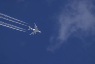 Aircraft in the sky at cruising altitude. Airbus A380 of the airline Ethihad en route to Abu Dhabi.
