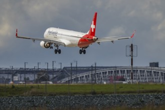 Aircraft approaching Stuttgart Airport. Aircraft registration: HB-JVJ, Helvetic Airways, Embraer
