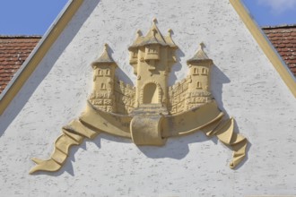 Town coat of arms in relief on the gable of the town hall, Barby, Saxony-Anhalt, Germany