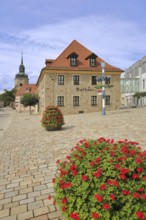 Market square with town hall and church tower of the town church, flower decoration, maypole,
