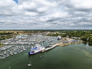Wight Light car ferry to Isle of Wight on Lymington River and marina from drone, Lymington, New