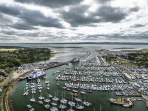 Wight Light car ferry to Isle of Wight on Lymington River and marina from drone, Lymington, New