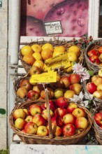 Fresh apples and fresh fruit with price tags in baskets in front of a greengrocer's shop, Bremen,