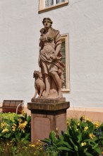 Ettlingen, Germany - August 2025: Sculpture of hunting goddess Diana in the castle garden of