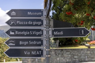 Signpost in the village to the museum, Via NEAT, church, Sedrun, Surselva, Graubünden, Switzerland