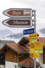 Signpost to the Bogn wellness and adventure pool and museum, Sedrun railway station, Surselva,