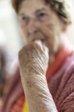 Close-up, authentic, unposed portrait of a 90+ year old senior woman with dementia and Alzheimer's