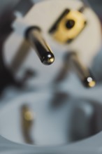 Close-up of a power plug, Schuko plug, with focus on the contact pins, symbol image for,