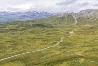 Gravel road through Jotunheimen National Park, view from Smørkollen mountain, Beitostølen,