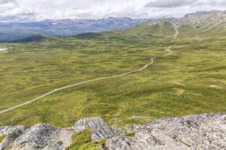 Gravel road through Jotunheimen National Park, view from Smørkollen mountain, Beitostølen,