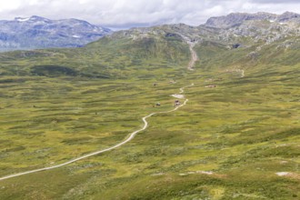 Gravel road through Jotunheimen National Park, view from Smørkollen mountain, Beitostølen,