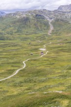 Gravel road through Jotunheimen National Park, view from Smørkollen mountain, Beitostølen,