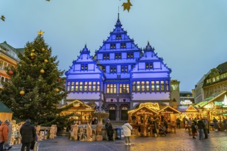 Christmas market at the colourfully illuminated Paderborn Town Hall at duskin Paderborn, North