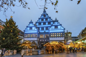 Christmas market at the colourfully illuminated Paderborn Town Hall at duskin Paderborn, North