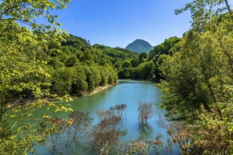Ibiur reservoir in tolosa, gipuzkoa, basque country, showcases calm waters reflecting lush green