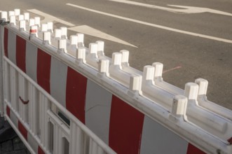 Borken, NRW, Germany, Red and white plastic roadblock closing a lane on an asphalt road during