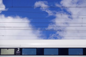 Travelling train, cloudy sky, summer, Germany