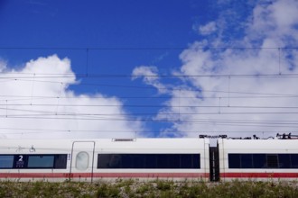 Travelling train, cloudy sky, summer, Germany