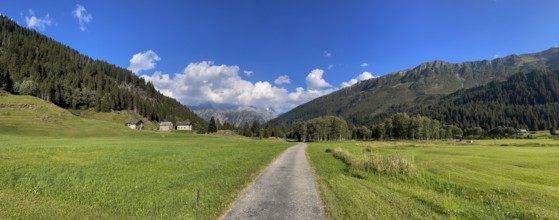 Small road and mountain huts in high valley, Campra, Lukmanier Pass, Blenio, Ticino, Switzerland