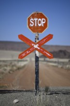 Stop sign at an ungated level crossing on the Lüderitz-Keetmanshoop railway line, near Goageb,