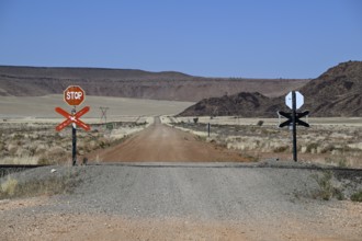 Stop signs at an ungated level crossing on the Lüderitz-Keetmanshoop railway line, near Goageb,