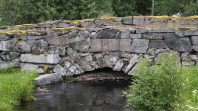 Old stone bridge crosses the river Risa, Risebru, Olavsweg or Olavsleden, Norway
