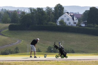 Golfer teeing off, golf course, Jessheim, UIllensaker, Akershus county, Norway