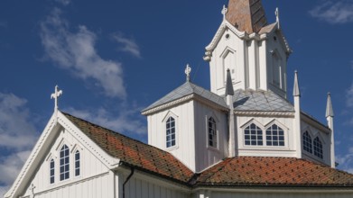 Close-up, white church building with tiled roofs, Tangen kirke or church, Olavsweg or Olavsleden,