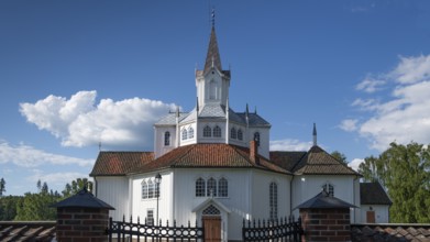 White church building with tiled roofs, Tangen kirke or church, Olavsweg or Olavsleden, pilgrimage