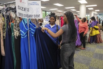 Detroit, Michigan USA - 13 September 2025 - High school students search for free homecoming dresses