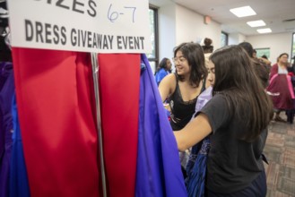 Detroit, Michigan USA - 13 September 2025 - High school students search for free homecoming dresses