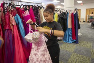 Detroit, Michigan USA - 13 September 2025 - High school students search for free homecoming dresses