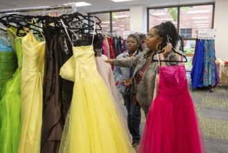 Detroit, Michigan USA - 13 September 2025 - High school students search for free homecoming dresses