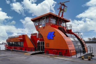 Hapag Lloyd ferry in orange, hvv ferry station at Dockland, fishing harbour, Hamburg, Germany