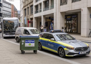 Bus and police vehicle in Großer Burstah, Hamburg, Germany