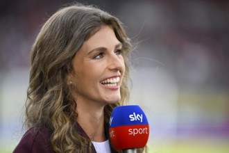 SKY presenter Mara Mones, portrait, smiles, interview, microphone, mike, logo, Voith-Arena,