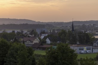Village view with church and Schiess Ausstattungshaus, Erlen, Thurgau, Switzerland
