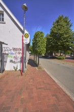 Bus stop church of the lines 670 Rieste and 672 Thiene, building, graffiti, lantern, trees, blue