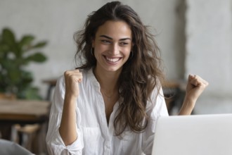Emotional business woman showing happiness. Concept of winning and achieving corporate goals and