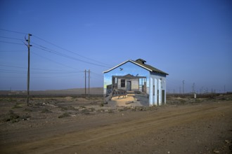 Painted house facade, graffito, brown hyena, diamonds, Oranjemund, Karas region, Namibia