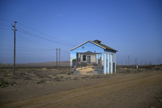 Painted house facade, graffito, brown hyena, diamonds, Oranjemund, Karas region, Namibia