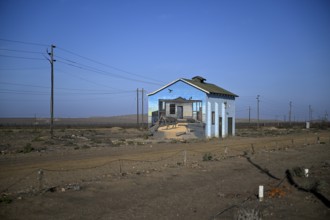 Painted house facade, graffito, brown hyena, diamonds, Oranjemund, Karas region, Namibia