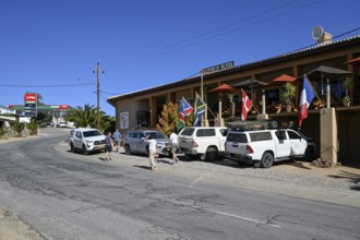 Tourists in front of the railway station hotel, Aus, Karas region, Namibia