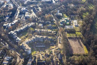Aerial view of the green school and sports field at the Talaue in the high-rise area Talaue in