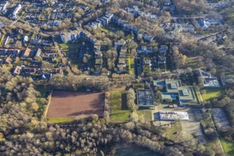 Aerial view of the green school and sports field at the Talaue in the high-rise area Talaue in