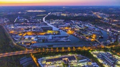Aerial view, night view of Dortmund harbour, historical building old harbour office, container
