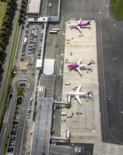 Aerial photo, Dortmund Airport, EDLW, Wickede, apron with two Wizzair jets and a Eurowings plane,