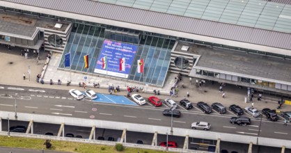 Aerial photo, Dortmund airport, departure level, arrival right of way, flags at airport entrance,